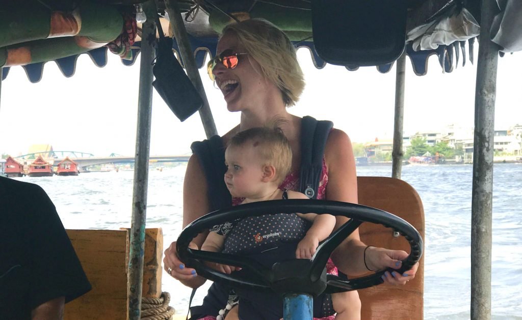 Driving a boat Bangkok while wearing a baby on my chest