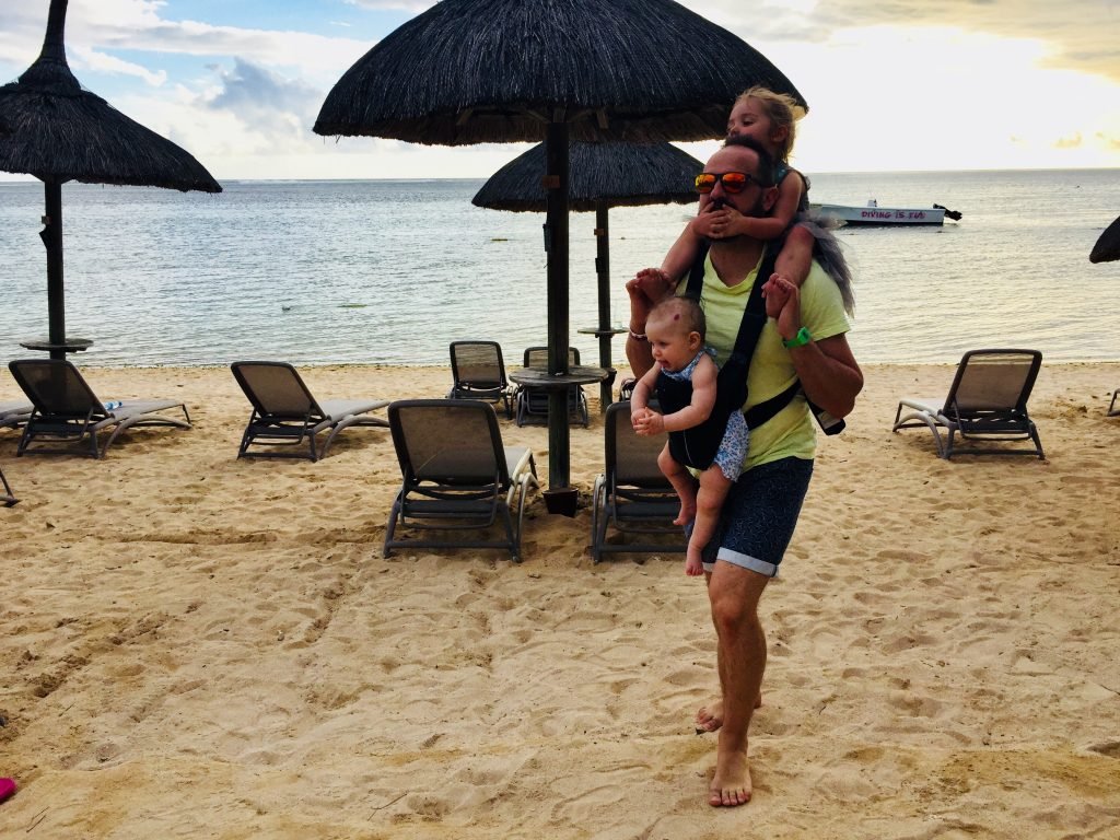 baby sling in use on a Mauritius beach