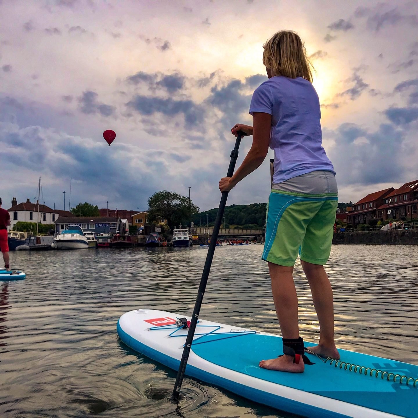 paddleboarding in Bristol, hot air balloons overhead