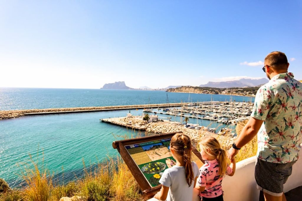 Kids looking over Moraira marina, Spain