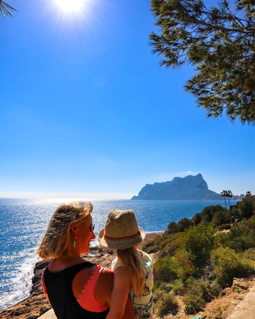 Mum and daughter looking at view of Calpe rock near Playa fustera beach