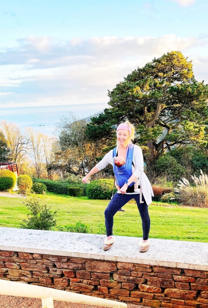 Wearing the Ergobaby embrace baby carrier flossing in devon